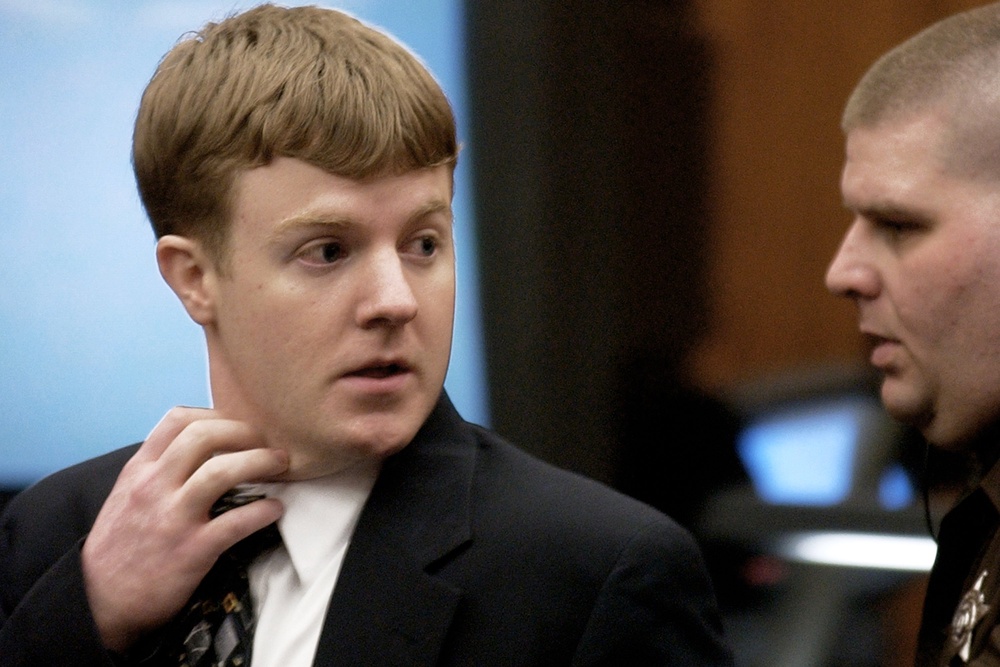 Wolfe, left, looks back towards his parents as he is led from the courtroom by a sheriff's deputy after being found guilty of capital murder in Manassas, Va., Jan. 22, 2002 (AP2002)
