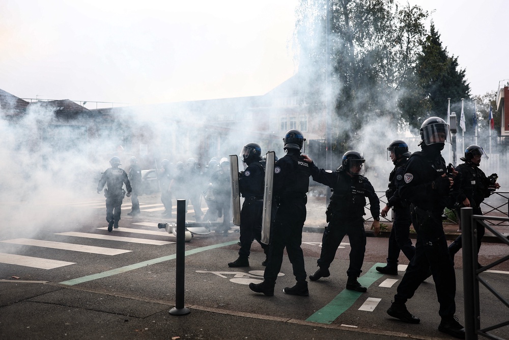 Police used tear gas to manage the crowds of furious demonstrators in Lille on Tuesday (AFP/Getty)
