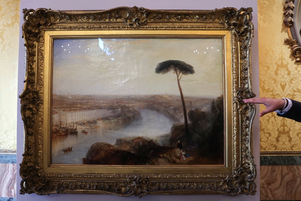 Sotheby’s Senior Specialist, British Paintings, Julian Gascoigne gestures towards William Turner’s 1835 painting 'Rome, from Mount Aventine' (Reuters)