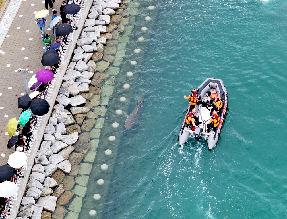 On 29 September, the Busan Coast Guard and other agencies deployed five vessels and used water jets to steer it towards the exit (AP)