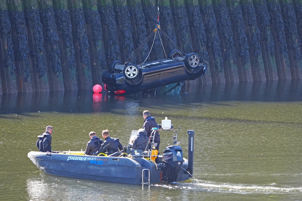The hatchback was lifted out using a crane (Owen Humphreys/PA) (PA Wire)