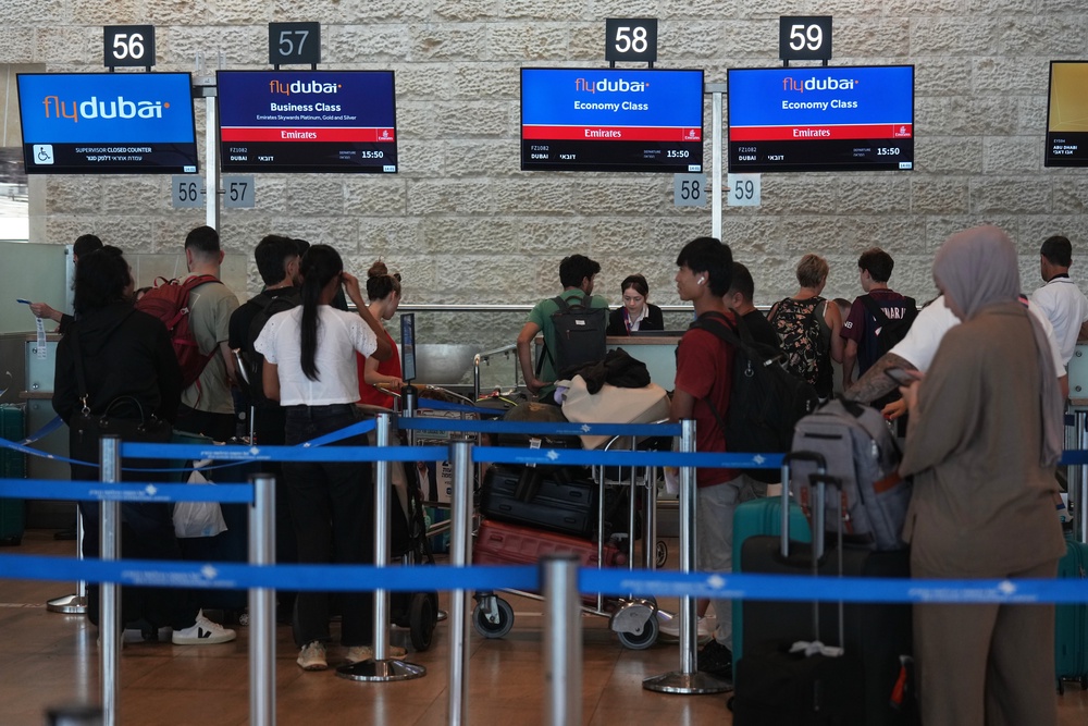 Passengers at Ben Gurion International Airport (Ariel Schalit/AP) (AP)