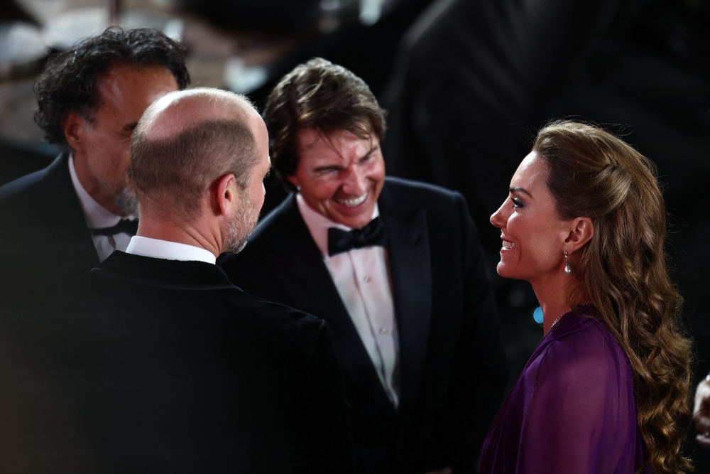 Tom Cruise was seen grinning from ear to ear while speaking to Kate at the 'Digger' world premiere (AFP/Getty)
