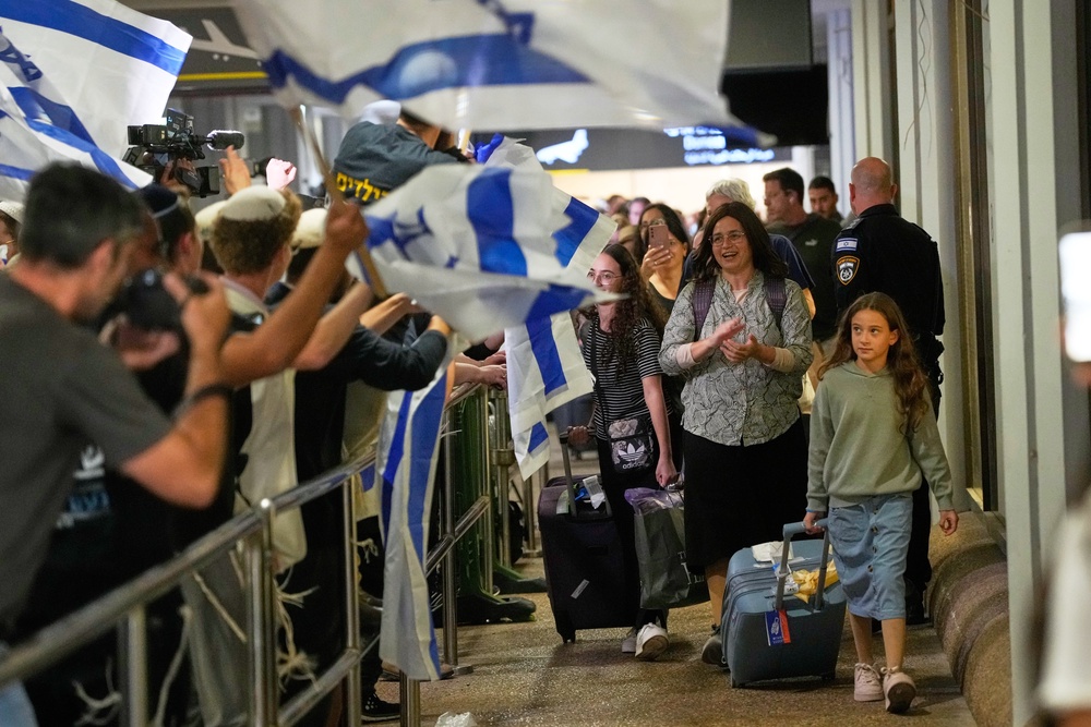 Passengers returning to Tel Aviv after the attack aboard a FlyDubai flight (AP)