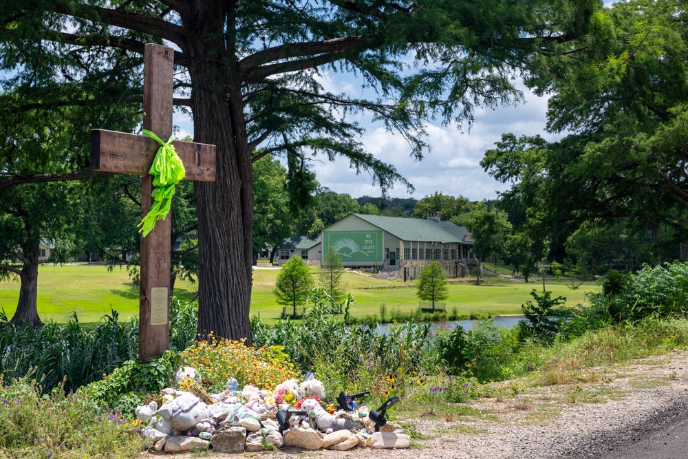 A makeshift memorial dedicated to the lives of the 25 girls and two teenage counselors who were killed during last year's Texas Hill Country flash floods is seen on June 24, 2026, in Hunt, Texas (Getty)