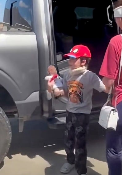 A Louisiana boy who survived a stabbing attack that left four others dead has returned home via police escort as local authorities dub him a 'superhero' (Terrebonne Parish Sheriff's Office)
