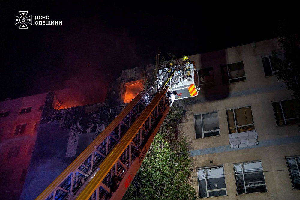 Rescuers work at a site of a damaged business centre hit during Russian military strike, amid Russia's attack on Ukraine, in Odesa, Ukraine 1 October 2026 (Reuters)