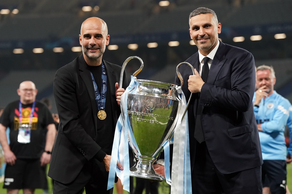 Manchester City chairman Khaldoon Al Mubarak, right, with the Champions League trophy (PA)