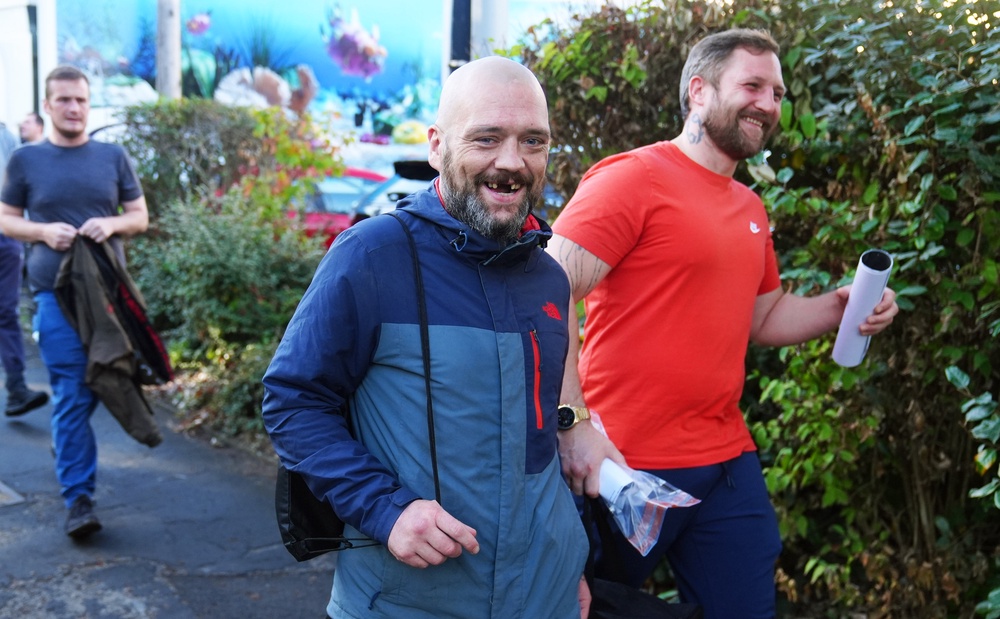 People leaving HMP Durham in north east England. Around 700 prisoners will walk free from jail in the first wave of the controversially expanded programme to free up spaces in prisons (PA)