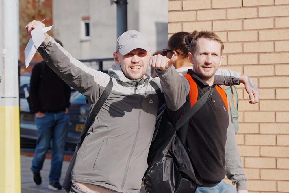 People celebrate as they leave HMP Bristol in Horfield, north Bristol (PA)