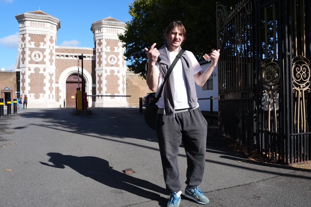 Ukrainian national Vladimir Hudzyk, 38, celebrates leaving HMP Wormwood Scrubs, in White City, London, as part of the early release scheme (PA)