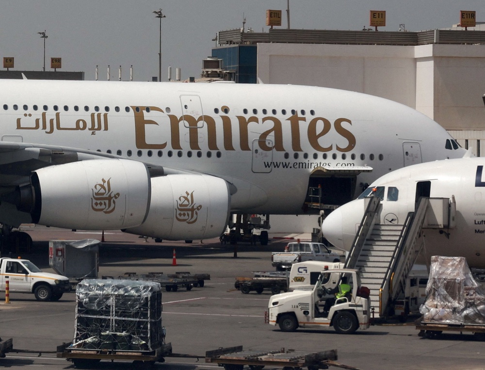 An Emirates aircraft is seen through the window of a Middle East Airlines airplane at Cairo International Airport, amid the U.S.-Israeli conflict with Iran, in Cairo (Reuters)