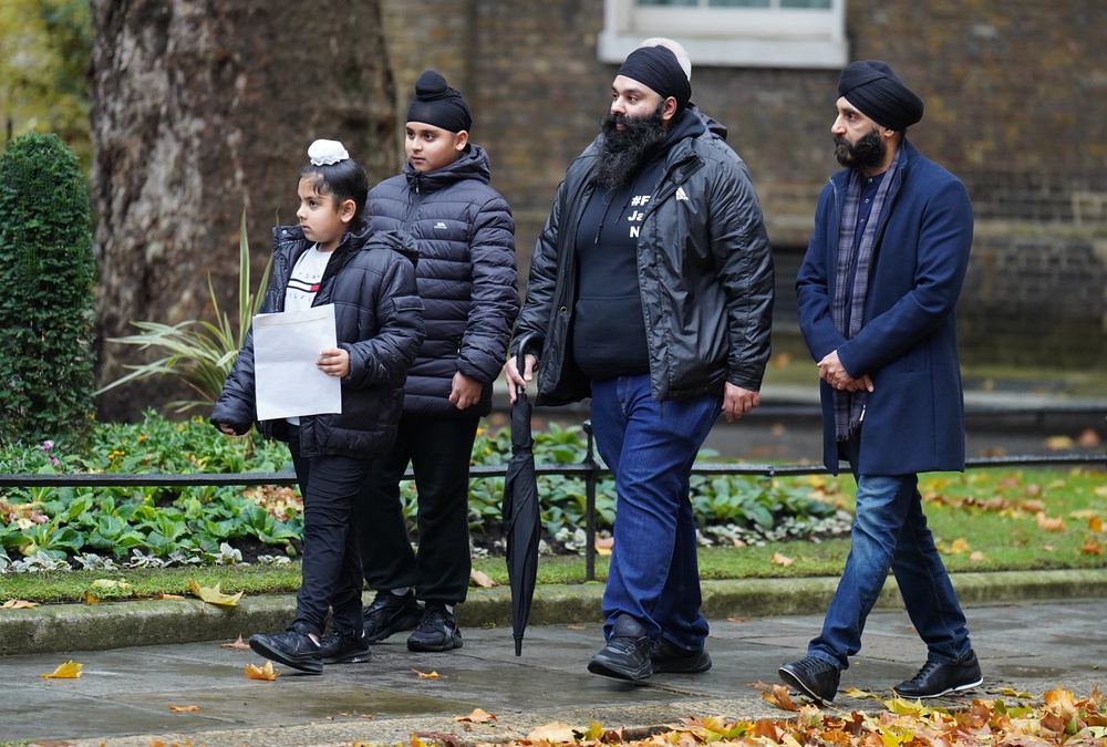 Members of the Free Jaggi Now Campaign hand in a petition to 10 Downing Street, London, in 2022. (PA)