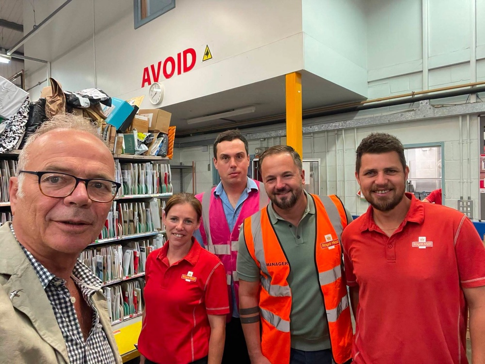 Stroud MP Simon Opher (left) spoke to Royal Mail staff in Dursley in July on the delays. He said the local postmen and women were working hard in the circumstances (Simon Opher)