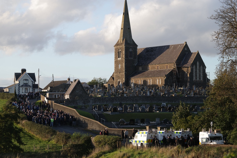 Loyalists gather near Drumcree Church as police form a barricade close to the Garvaghy Road (Peter Morrison/PA) (PA Wire)