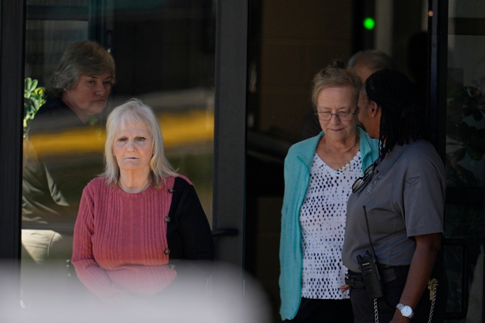 May Martinez, left, leaves Riverbend Wednesday (AP)