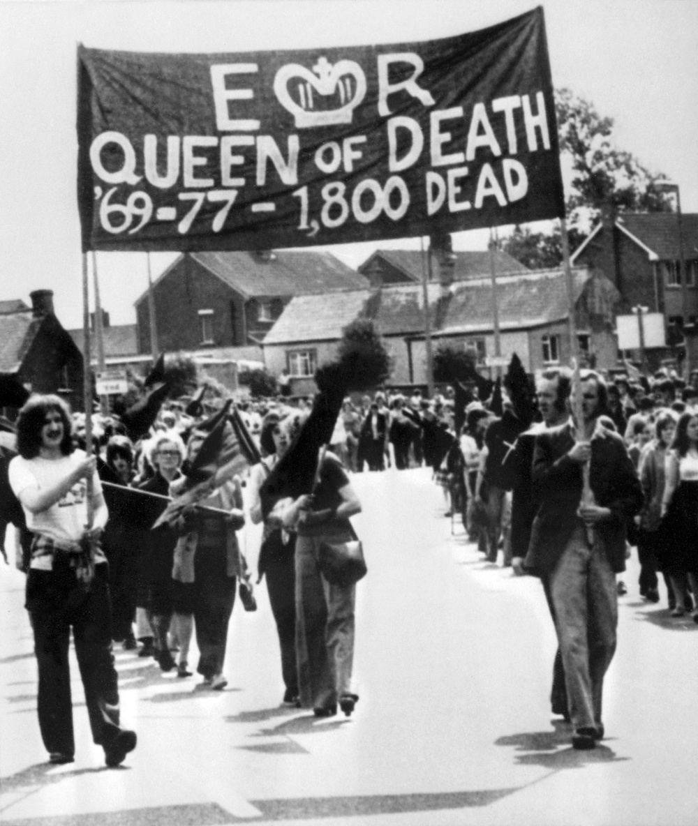 Members of the Provisional Irish Republican Army march through Belfast in 1977 (AFP/Getty)
