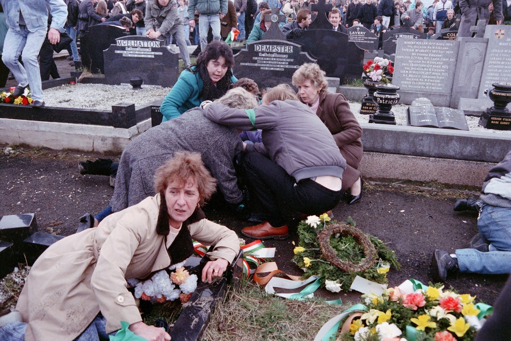 During the funeral of the three IRA's members killed in Gibraltar by British secret agents, the crowd of mourners dives for cover as loyalist gunmen open fire (AFP/Getty)