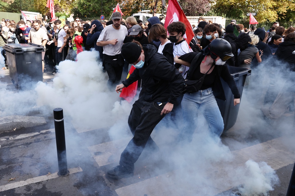 Police fire teargas towards French students during a march in Aubervilliers (Getty)