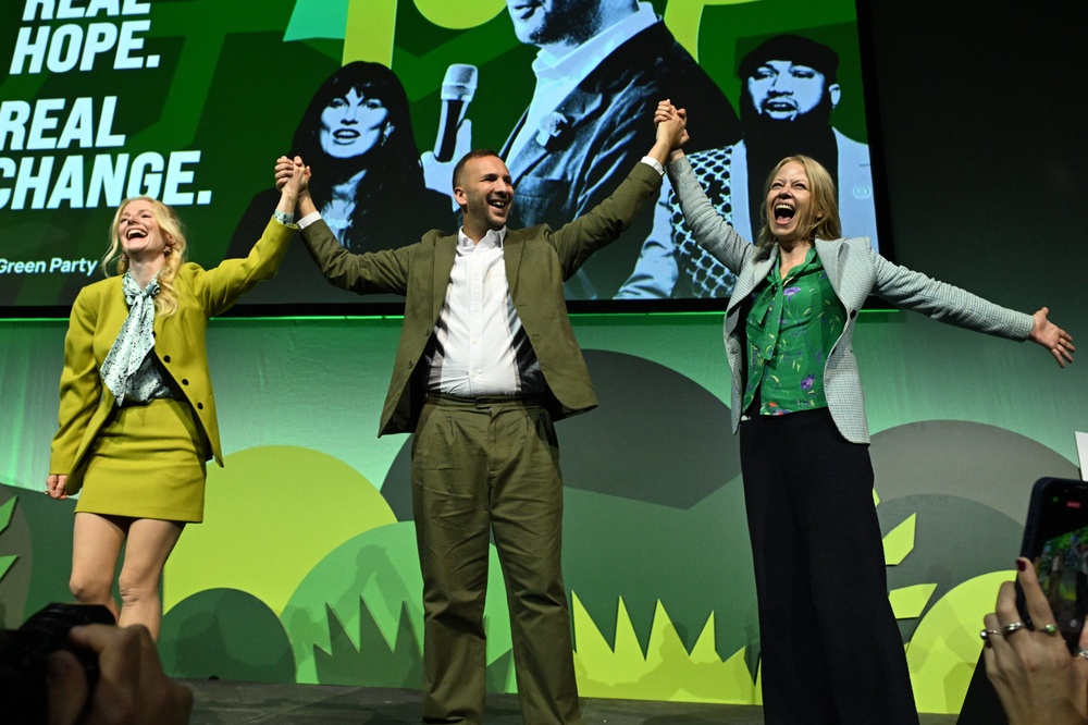 Green leader Zack Polanski with MPs Hannah Spencer, left, and Sian Berry on stage at the party conference in Brighton (Will Colebourne/PA) (PA Wire)