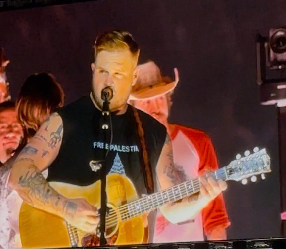 Country singer Zach Bryan wore a ‘Free Palestine’ shirt during his concert at Robert Kraft’s Gillette Stadium Friday night (X via @hollley)