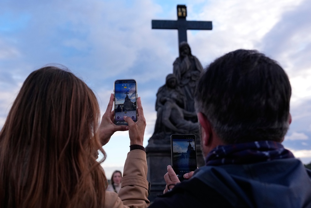 People pose to recreate a famous photo of two members of Depeche Mode, taken by Dutch photographer Anton Corbijn in 1988 (AP)