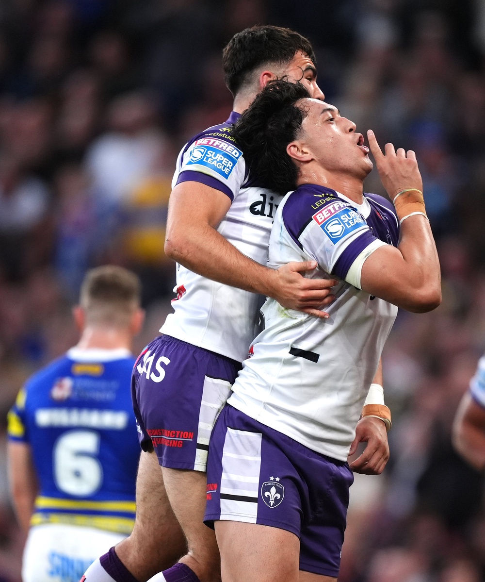 Isaiah Vagana (right) celebrates crossing for Wakefield (Mike Egerton/PA).
