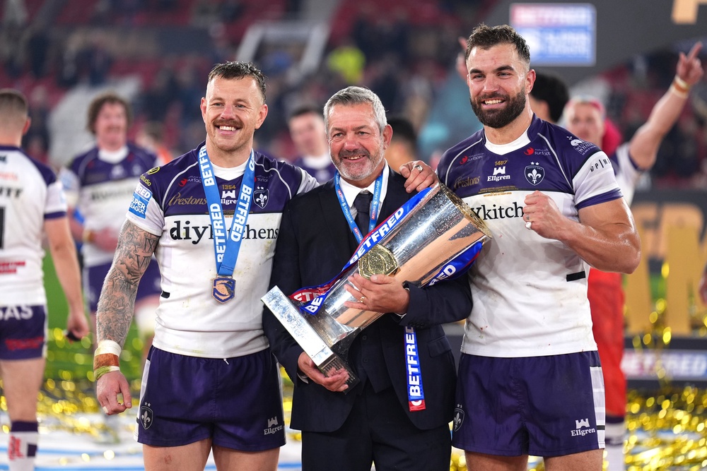 Daryl Powell (centre), Tom Johnstone (left) and Mike McMeeken celebrate with the trophy (Mike Egerton/PA). (PA Wire)