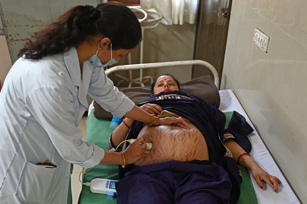 A pregnant woman is checked by a doctor at a hospital in Dehra, in the Kangra district of India's Himachal Pradesh state (AFP/Getty)
