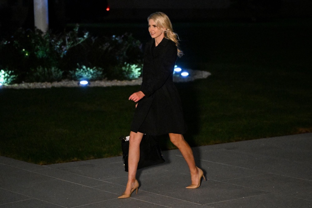 Question have been raised about Harp's proximity to President Donald Trump as she is often seen traveling with him (AFP via Getty Images)