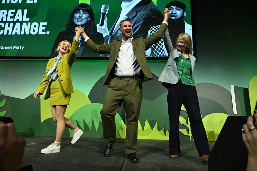 Green Party leader Zack Polanski is joined by party MPs Hannah Spencer (left) and Sian Berry (right) after delivering his speech during the conference in Brighton (Will Colebourne/PA) (PA Wire)