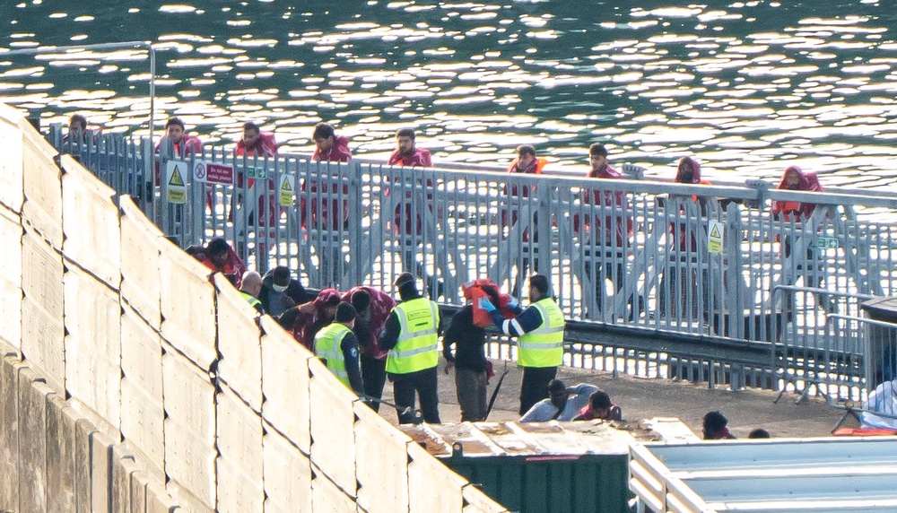 A group of people thought to be migrants are brought in to the Border Security Command compound in Dover, Kent, from a Border Security Command vessel following a small boat incident in the Channel. Picture date: Sunday October 4, 2026. (PA)