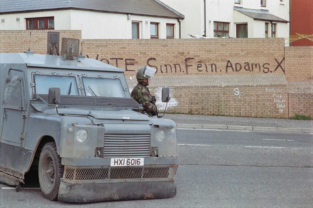 A soldier patrols in the republican district of Belfast, on 23 March 1988 (AFP/Getty)