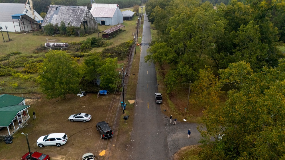 Authorities, below to the right, investigate the scene of a mass shooting where at least two people died and 35 were injured when struck by bullets Sunday morning, according to the Georgia Bureau of Investigation, Sunday, Oct. 4, 2026, in Vienna, Ga. (AP Photo/Mike Stewart) (Copyright 2026 The Associated Press. All rights reserved)