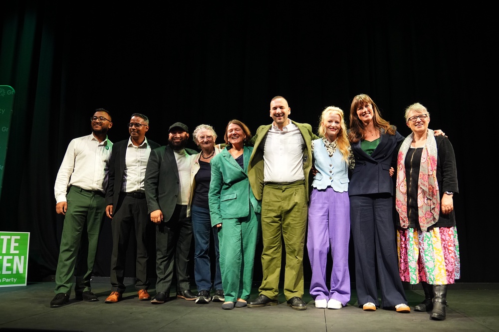 Leader Zack Polanski stands with Green Party members (PA) (PA Wire)
