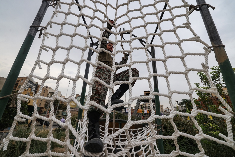 An Iranian man demonstrates an obstacle course during the inauguration of a training centre by the Iranian army in Tehran (AFP via Getty Images)