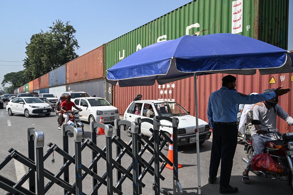 Shipping containers block a road in Islamabad on 2 October 2026 (AFP/Getty)