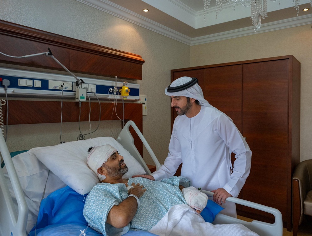 Dubai’s crown prince, Hamdan bin Mohammed Al Maktoum, meets Smit Machchhar, captain of the Flydubai flight who was stabbed by his colleague (Reuters)