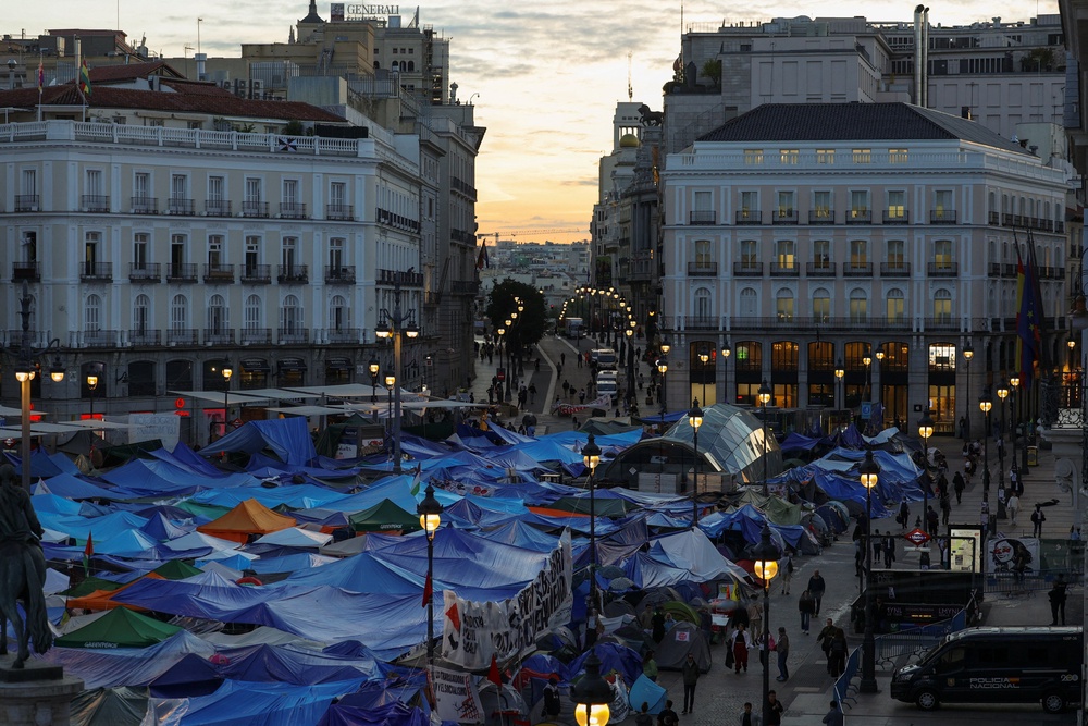 Protesters camp in Puerta del Sol, where they are demanding political measures to stop evictions and address the housing crisis, following the eviction of an 87-year-old woman from her home (Reuters)