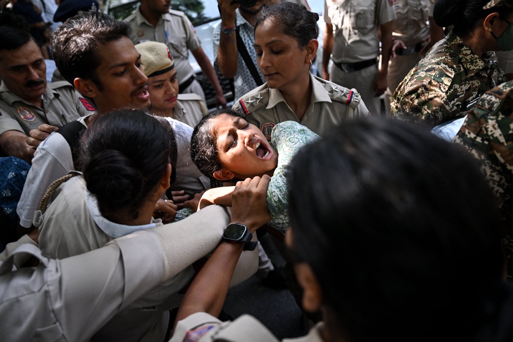 Police detain a protester during a demonstration against chief election commissioner Gyanesh Kumar in Delhi on 3 October 2026 (AFP/Getty)