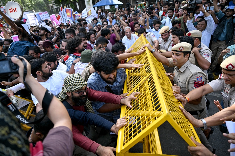 Protesters scuffle with police during the demonstration (AFP/Getty)