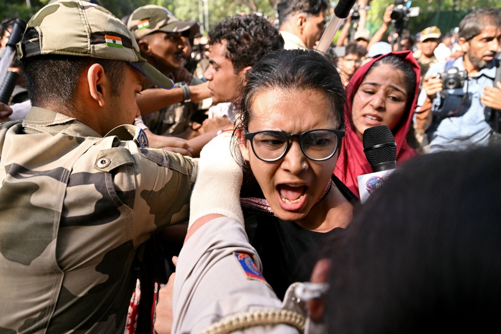 Police detain student leader Neha Bora during a protest against chief election commissioner Gyanesh Kumar in Delhi on 3 October 2026 (AFP/Getty)