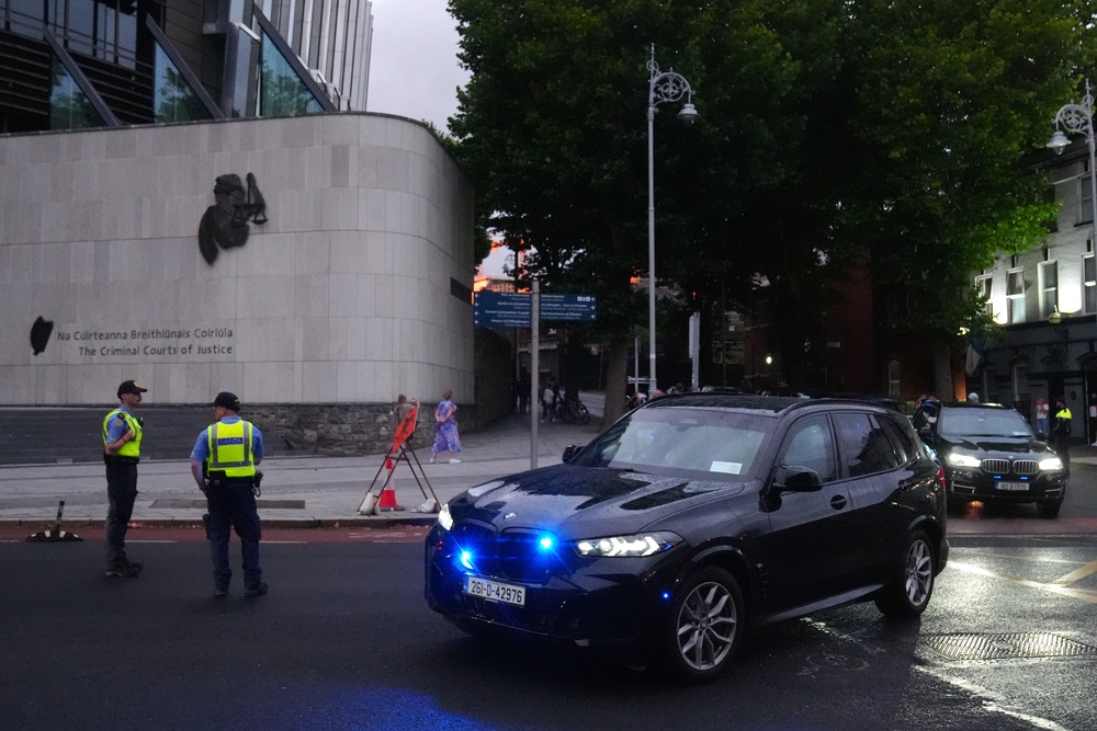 Garda vehicles leaving the Criminal Courts of Justice in Dublin (Brian Lawless/PA) (PA Wire)