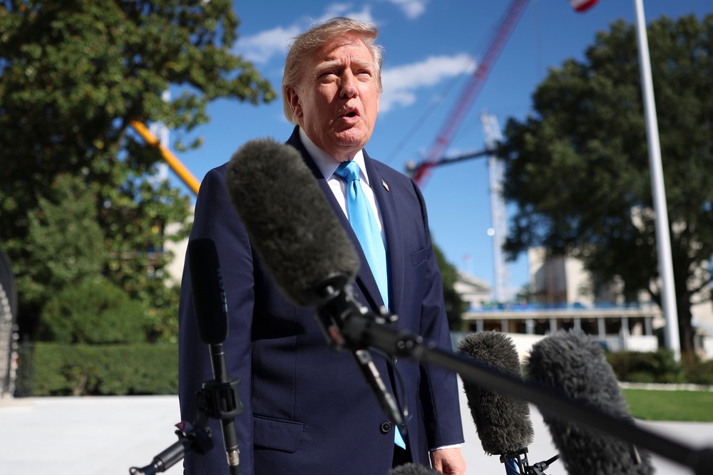 Donald Trump speaking to reporters on the South Lawn of the White House on Monday (Tom Brenner/AP) (AP)