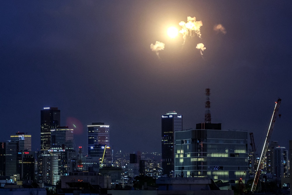 Explosions from projectile interceptions by Israel's Iron Dome missile defence system are pictured over Tel Aviv on February 28 (AFP/Getty)