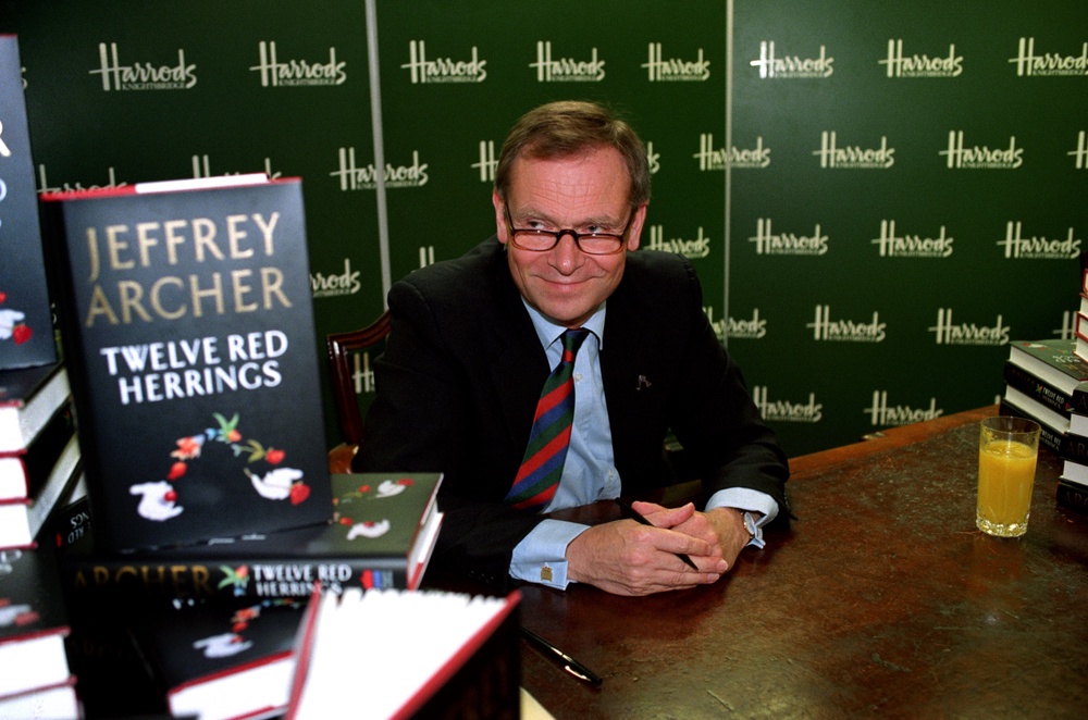 Lord Archer during a signing session at Harrods for his novel Twelve Red Herrings in 1994 (PA) (PA Archive)