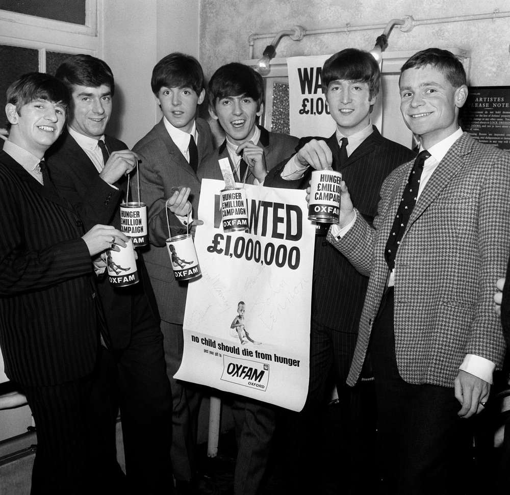 Jeffrey Archer (far right) with the Beatles and newspaper editor Nicholas Lloyd in 1963 promoting an Oxfam collection (PA) (PA Archive)