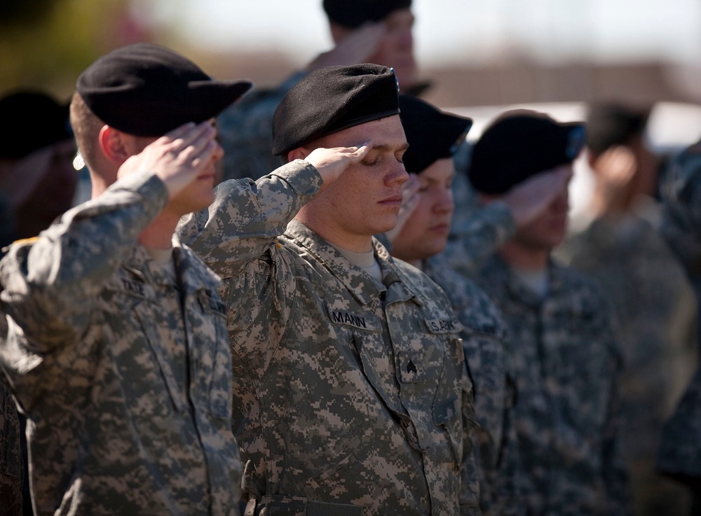 Soldiers salute at a remembrance service for Fort Hood victims on the first anniversary of the shooting in Killeen, Texas, on 5 November 2010 (Getty)