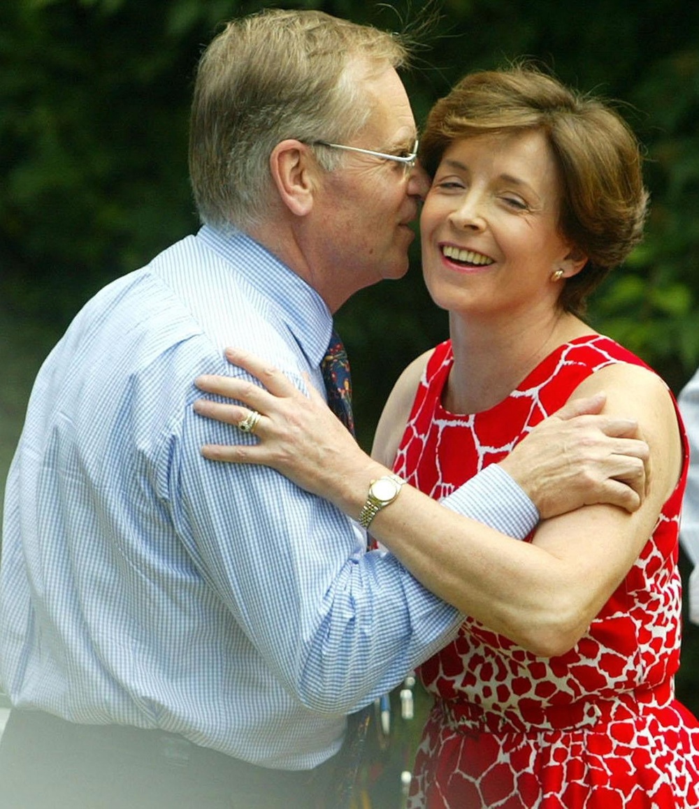 Lord Archer is greeted by his wife, Lady Archer, at their home at Grantchester, near Cambridge, following his release from Hollesley Bay open prison in Suffolk in July 2003. (PA)