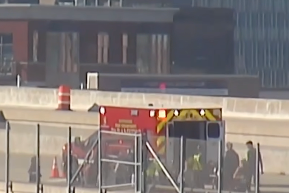 Footage showed the runner receiving medical care on Milwaukee's iconic Hoan Bridge (WISN 12 News)
